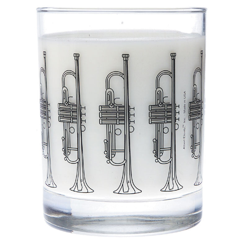 A clear glass tumbler with trumpet illustrations around its surface.