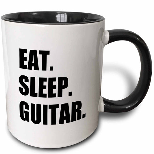White mug with black interior and handle, featuring 'Eat. Sleep. Guitar.' text.