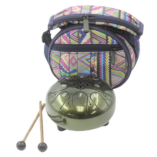 Green metal tongue drum with patterned carrying case and mallets on a white background
