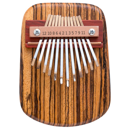 A 12-key zebrawood kalimba, also known as a thumb piano, with 12 metal keys mounted on a metal bridge, displayed on a white background.